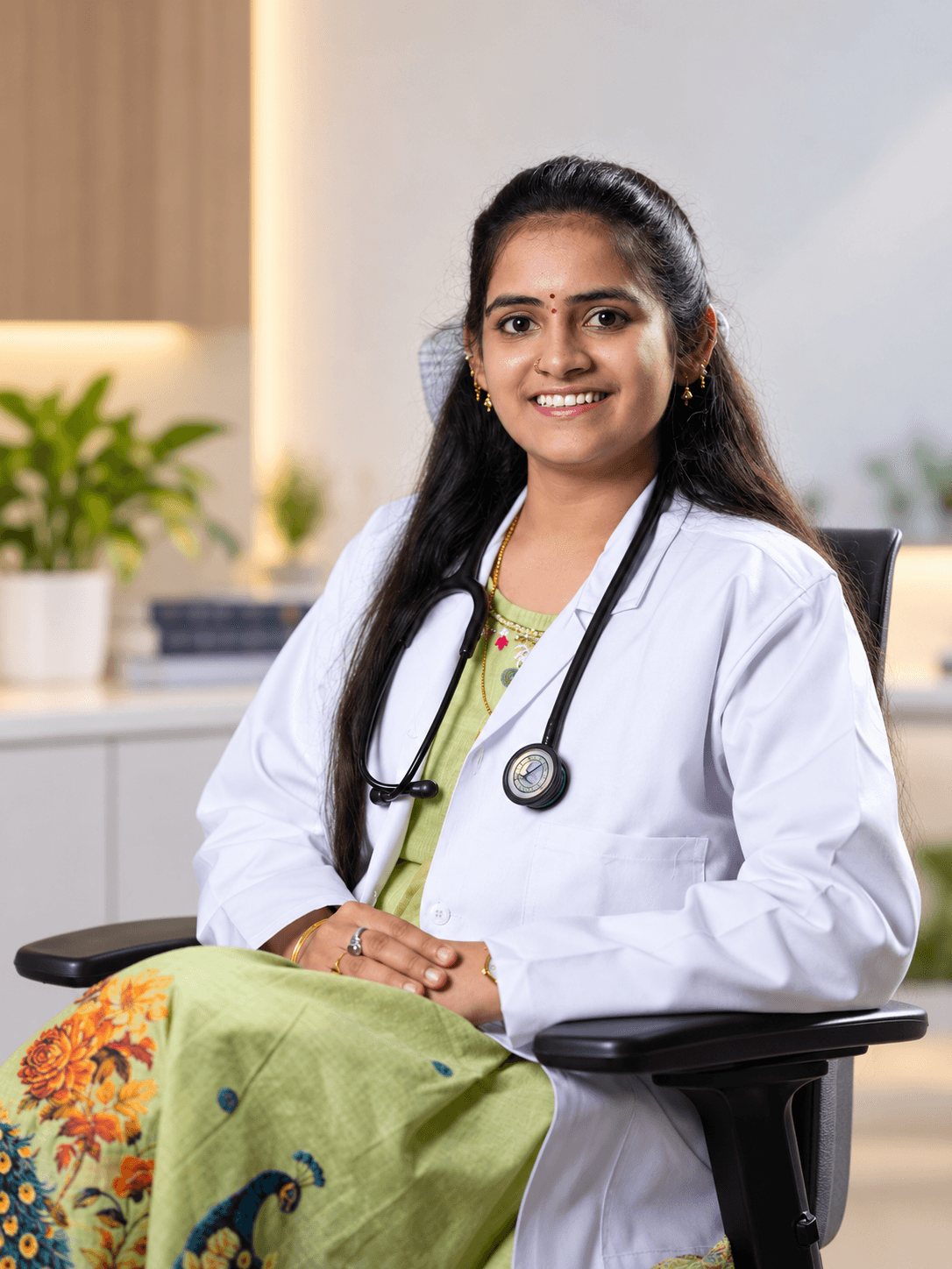 Dr. Harshini Sharma smiling in her clinic